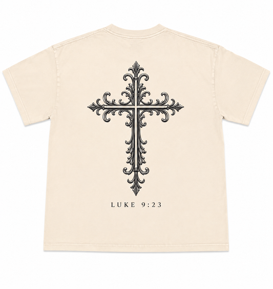 Cream oversized Christian T-Shirt with a large ornate cross graphic and Luke 9:23 on the back.